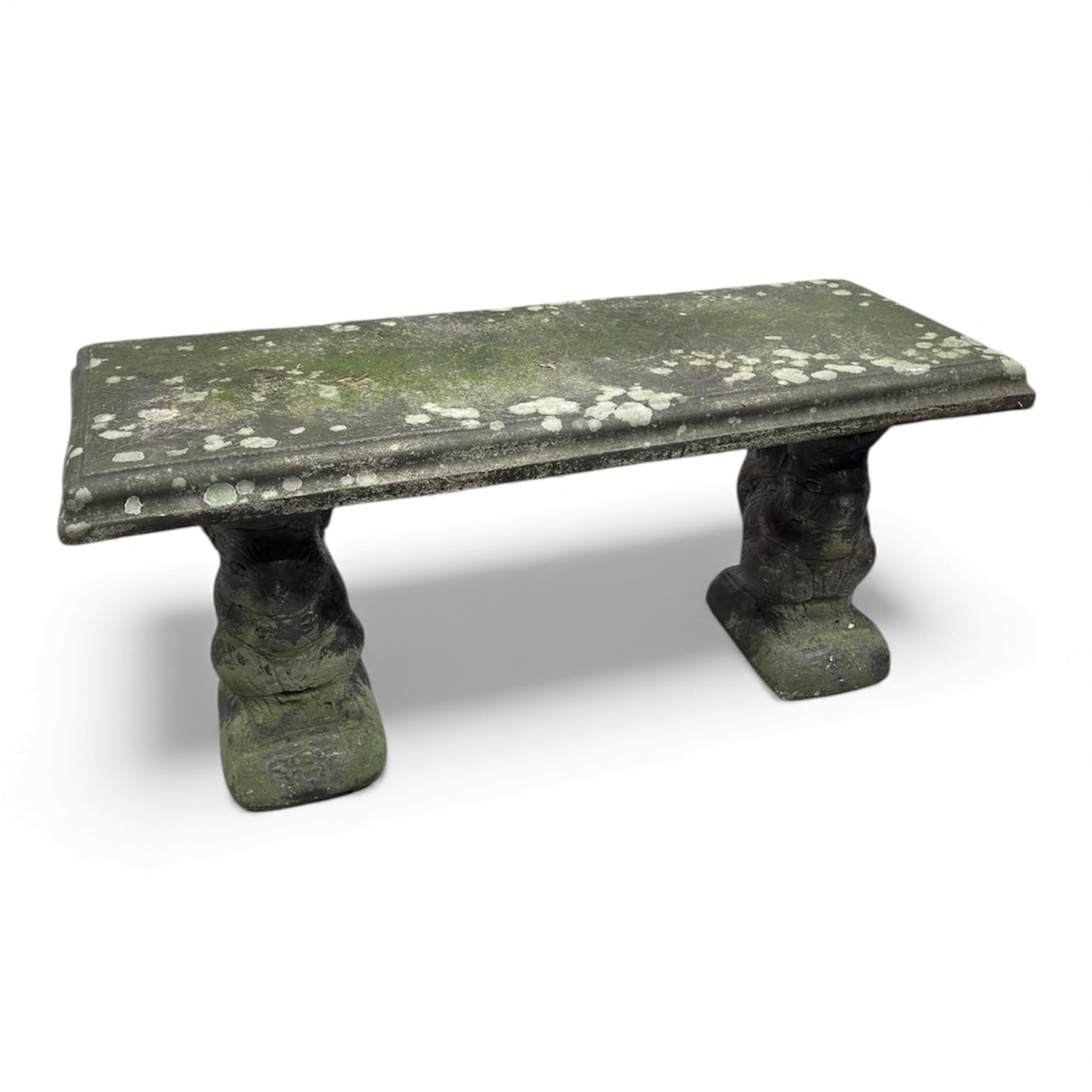 Weathered cast-stone garden bench with squirrel designed supports and rectangular top