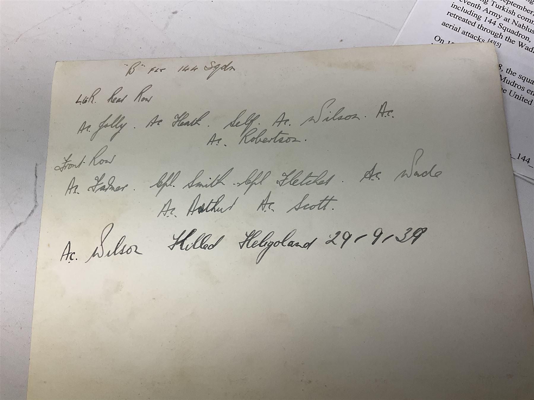 144 Squadron RAF - album containing over one hundred photographs and postcards of varying sizes including group shots, aircraft on the ground and in the air, German aircraft, crashes etc; sizes from 3.5 x 6cm to 16 x 21cm; and quantity of modern reference material
