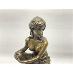  Art Deco style bronze modelled as a female figure, holding her knee, seated upon a chair, after 'Pierre Collinet', H28cm