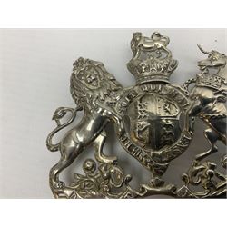 Victorian Volunteer Medical Staff Corps white metal helmet plate in the form of Victorian crowned Royal Arms with three part lower scroll for “VOLUNTEER MEDICAL STAFF CORPS”; three lug fittings to the reverse L8.5cm