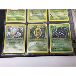 Collection of Pokemon trading cards, mostly 1999 Wizards Pokemon cards to include holo Charizard 4/102, first edition holo Machamp 8/102, further holographic cards; Dark Flareon 35/82 and Dark Vaporeon 45/82, cards from themed sets and 4th edition prints; 1998 Electronic Pokédex with cardboard boxes for themed decks Blackout, Overgrowth and Power Reserve Jungle, along with a large quantity of energy and trainer cards 