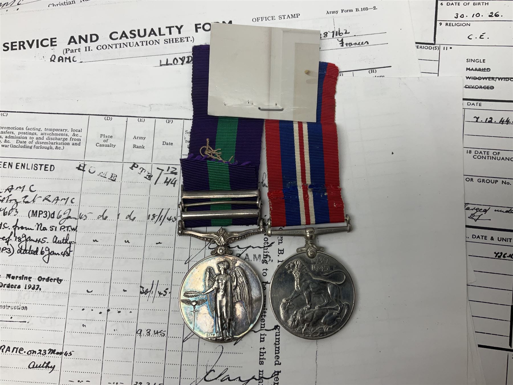 George VI General Service Medal with two clasps for Palestine 1945-48 and Cyprus and MID oak leaf awarded to 14887162 Sjt. C.F.A. Lloyd R.A.M.C. together with WW2 War Medal 1939-1945; both with ribbons; and quantity of photocopied research material including Army Records and London Gazette