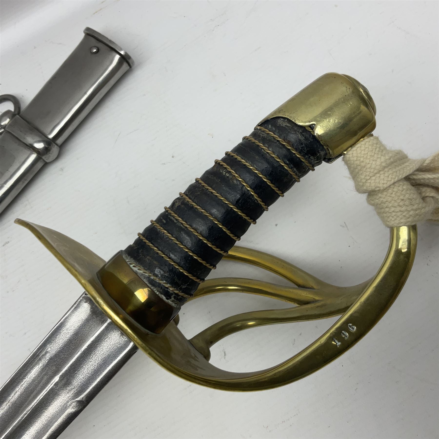 Early 19c French 1st Empire Heavy Cavalry trooper's sword, the 95.5cm double fullered blade with various stamped marks and inscribed Klingenthal 1814 to the back edge, four-bar brass hilt with wire-bound leather grip, knucklebow numbered 139; in polished steel scabbard with two suspension rings L117cm overall