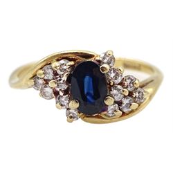 Gold oval sapphire and diamond crossover cluster ring, stamped 14K