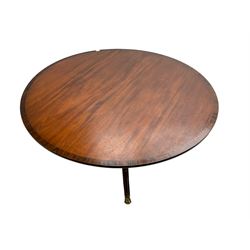 Shaw and Riley of Thirsk - Regency design mahogany dining table, the banded circular top on turned pedestal, four splayed supports with hairy paw brass caps