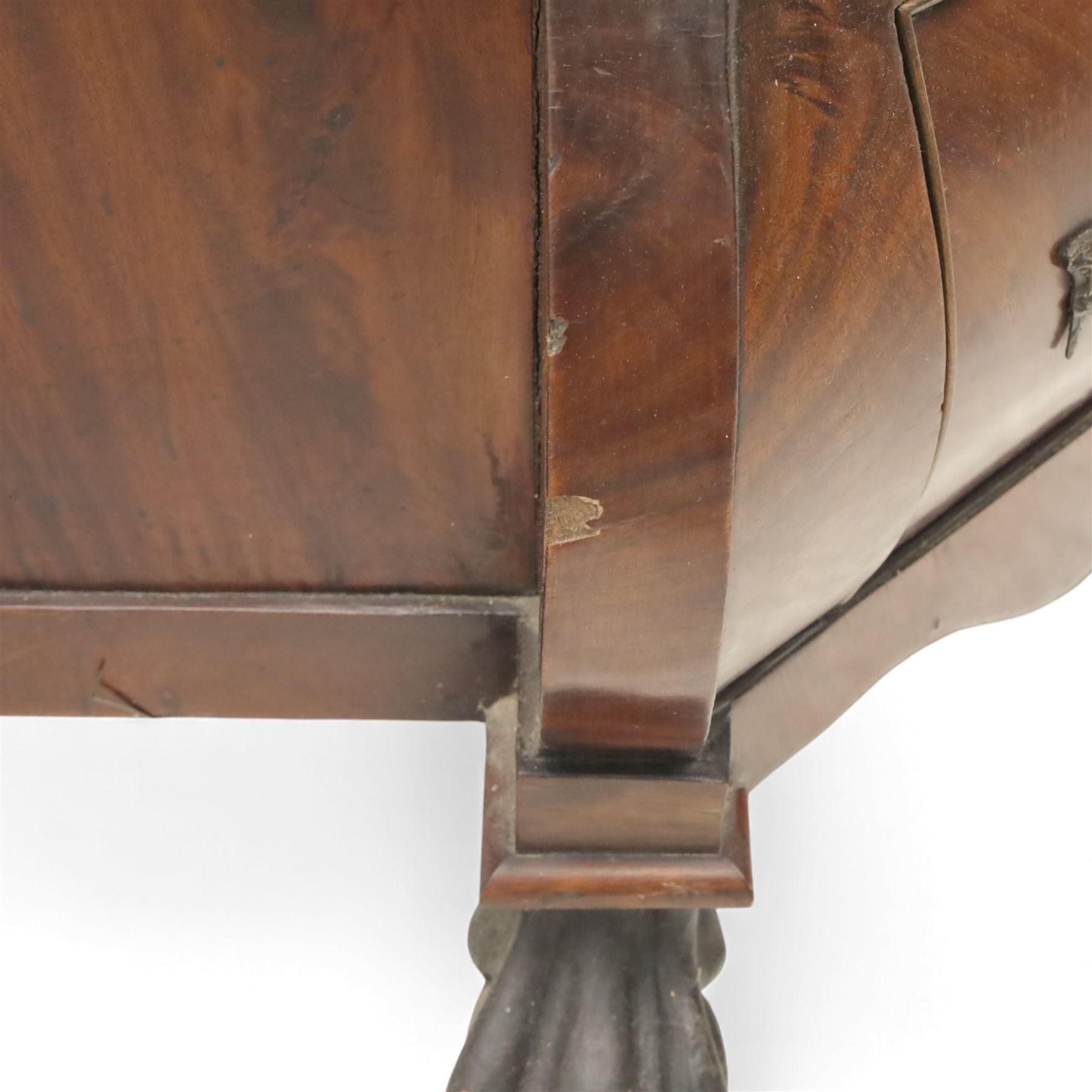 Late 19th century Continental bombe cabinet on chest, shaped moulded cornice with carved cresting, the upper section enclosed by a pair of arched glazed doors with astragal glazing revealing a shelved interior, the lower section fitted with four graduating drawers with rococo-style metal handles, serpentine front and sides, raised on scroll and paw feet