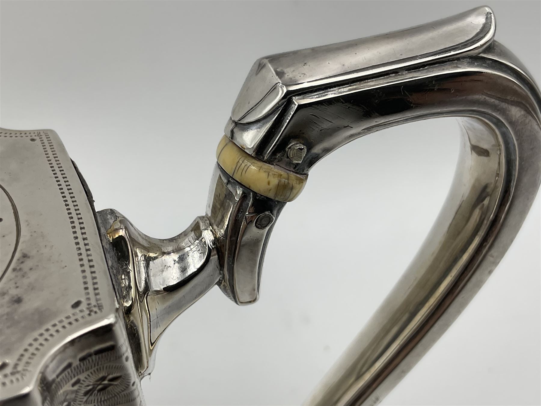 Victorian three-piece silver tea service, comprising teapot, twin handled open sucrier and milk jug, of oval form with shaped rim and C handles, each engraved with crests and bands of strapwork decoration, the milk jug and sucrier with gilt interiors, hallmarked Josiah Williams & Co, Exeter 1881, the teapot with ivory insulators and finial, all contained with a tooled leather, blue silk and velvet lined fitted case, retailed by West & Sun, Dublin 
This item has been registered for sale under Section 10 of the APHA Ivory Act