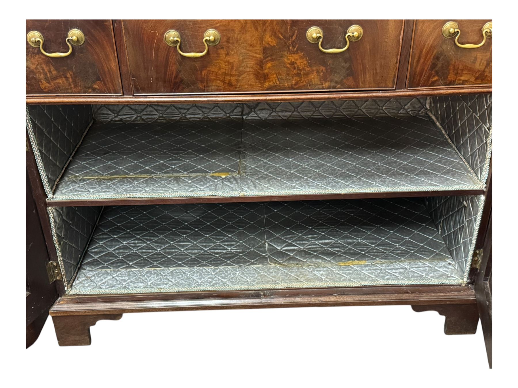 George III mahogany bookcase secretaire, dentil cornice over blind fret work frieze, enclosed by two astragal glazed doors, central secretaire drawer with fall front enclosing leather writing surface and small drawers, two flanking short drawers over double cupboard, on bracket feet