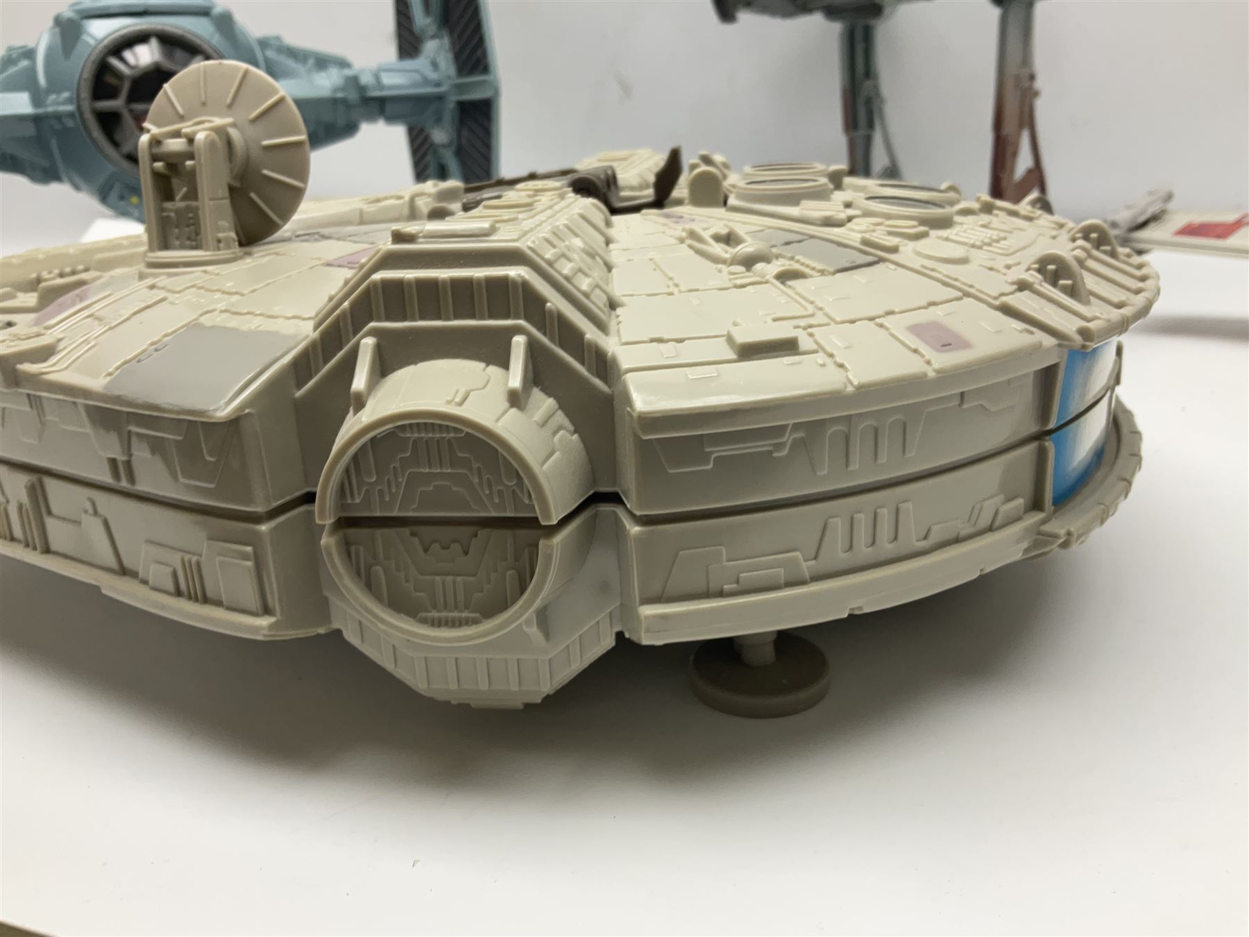Star Wars - four space/land vehicles comprising Millenium Falcon with hinged top and figures; TIE Fighter; X-Wing Fighter with pilot; and AT-ST 'Chicken Walker' transporter; all unboxed (4)