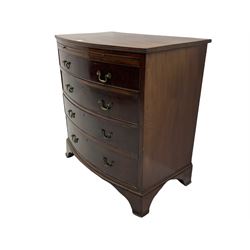 Late Georgian mahogany bow front bachelor's chest, reed moulded top over slide and four graduating drawers, lower mould, on shaped 