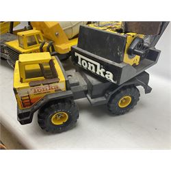 Tonka - five large scale pressed steel vehicles comprising Cement Mixer, Mighty Mobile Crane, Jeep and two Dumper Trucks (5)