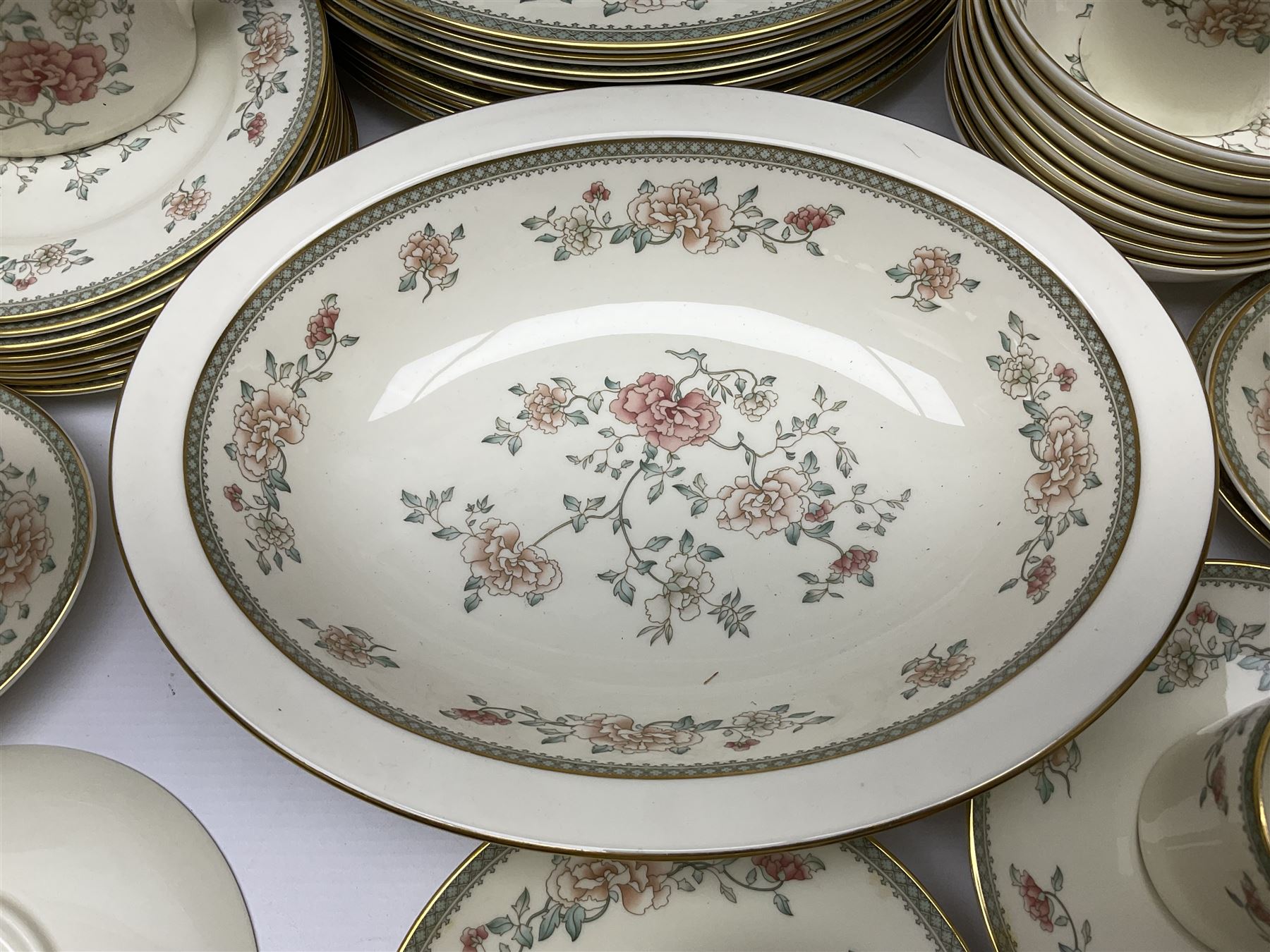 Minton Jasmine pattern tea and dinner wares, including dinner plates, sauce boats, side plates, bowls, teacups, coffee cans and twin handled soup bowls, etc (122)
