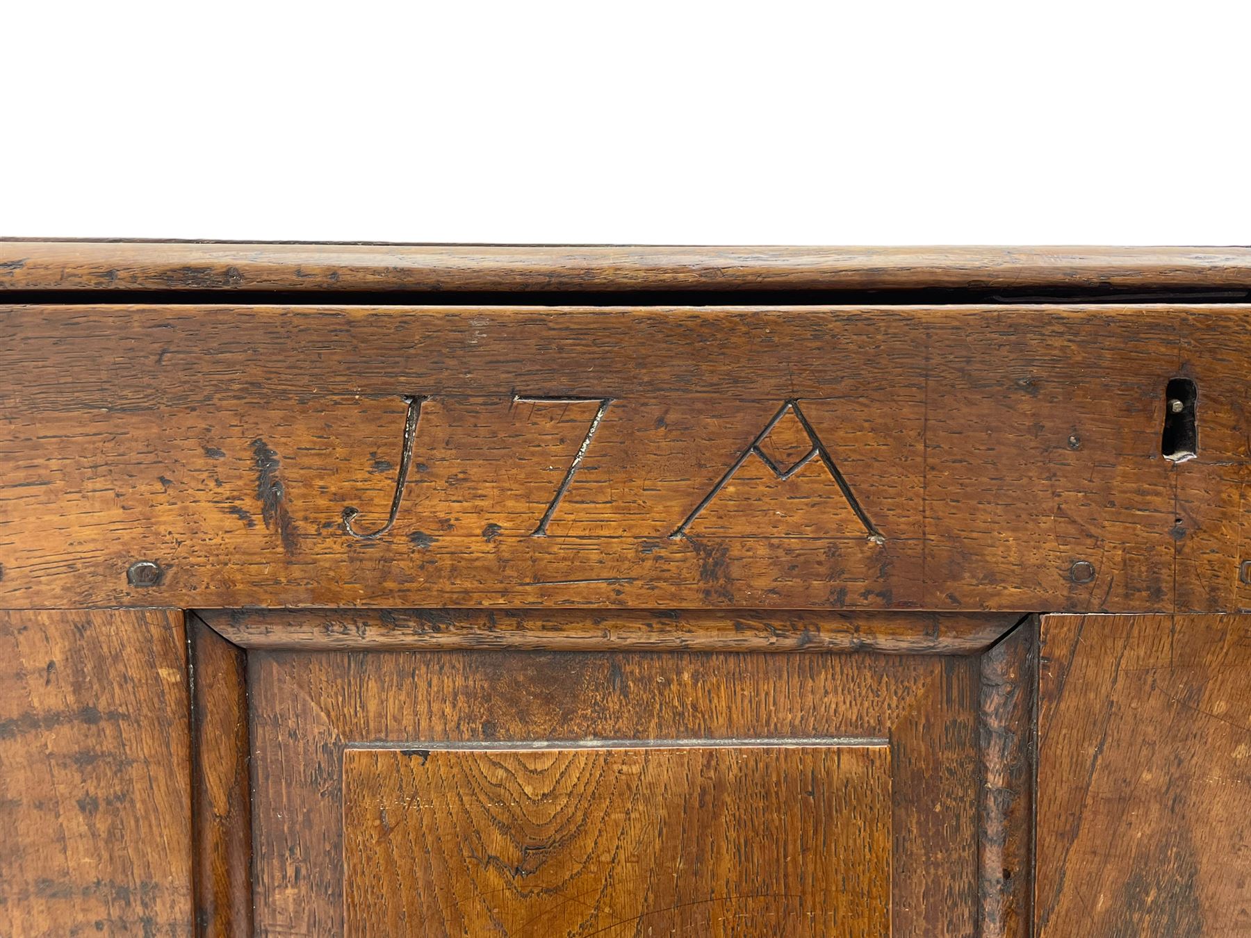 Georgian oak mule chest, moulded rectangular hinged lid over quadruple fielded panel front, the frieze inscribed '17 A Y 57', fitted with two drawers, panelled ends and back, on stile supports