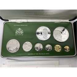 Two Coinage of Belize silver proof eight coin sets, 1974 and 1979, from ten dollars to one cent, minted at the Franklin Mint, cased with certificates; and two National Coinage of Guyana proof eight coin sets, 1976 and 1979, from ten dollars to one cent, containing 925 silver ten dollar and 500 silver five dollar coins, minted at the Franklin Mint, cased with certificates (4)