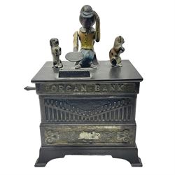 American 'Organ Bank' musical cast-iron mechanical money bank with hand cranked action and seated figure with two dancing dogs on top; locking door to base (no key); marked to the back 'Pat June 13 1882', H19cm