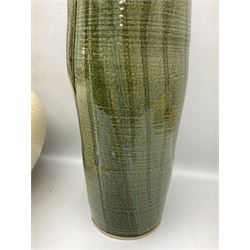 Large cream crackle glaze table lamp, together with a tall studio pottery vase in green with single loop handle, with impressed makers mark, H49cm