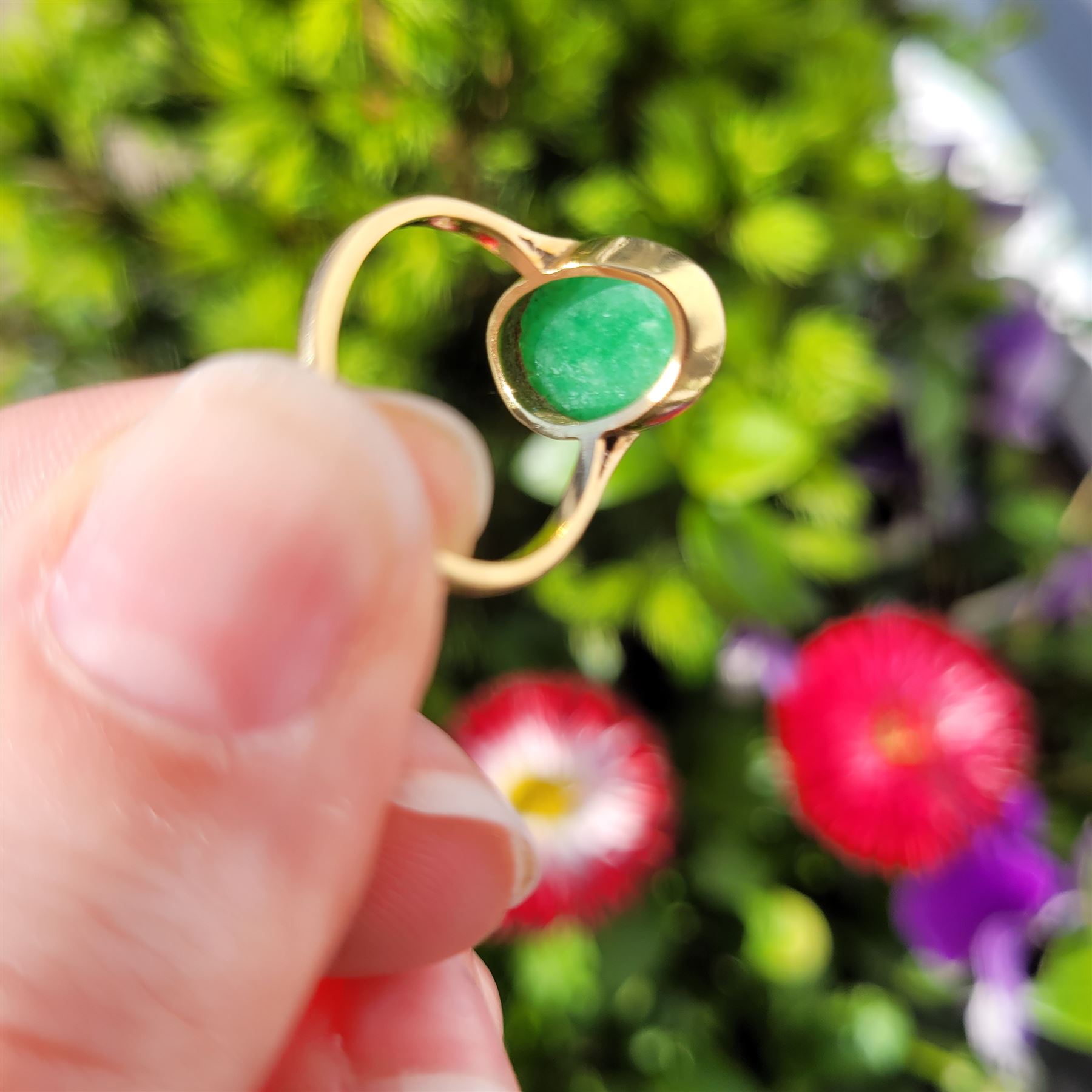 Early - mid 20th century gold jade ring, bezel set with a single oval cabochon jade of approx 4.10 carat, stamped 18ct