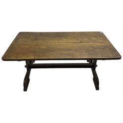 Early 20th century oak refectory dining table, rectangular top with rounded corners, twin pillar end supports on sledge platform and block feet, united by pegged stretcher 