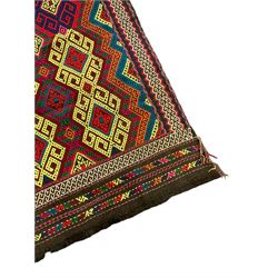 Flatweave geometric design rug, decorated with trailing hooked medallions within zig-zag bands, bright multi-coloured ground 