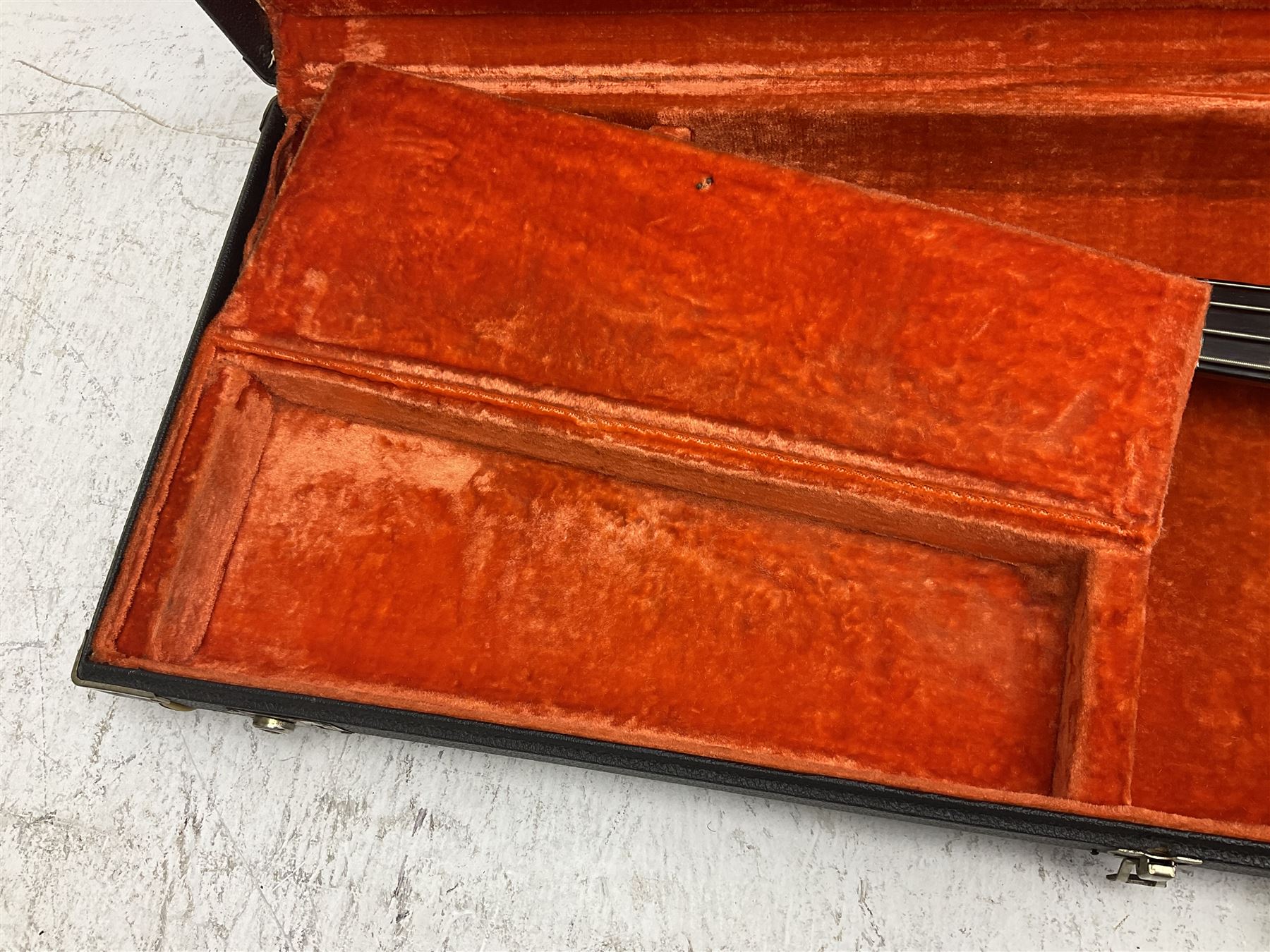 1963 Fender Jazz three-knob bass guitar; impressed with date code 7AUG63A on end of neck and serial no.L08587 on back plate; all original but re-finished in white in the 1970s; sold with photographs of the instrument in the 1960s with original finish and in the 1970s re-finished; L117.5cm; in original hard carrying case; Provenance: the professional guitar of Howard Livett from new to his death in 2005. Howard played in The Humperdincks, the backing group for Englebert Humperdinck, also played in the backing group for Max Bygraves and in the band Hedgehoppers Anonymous. The guitar is also sold with a manuscript letter of provenance from Howard's wife.