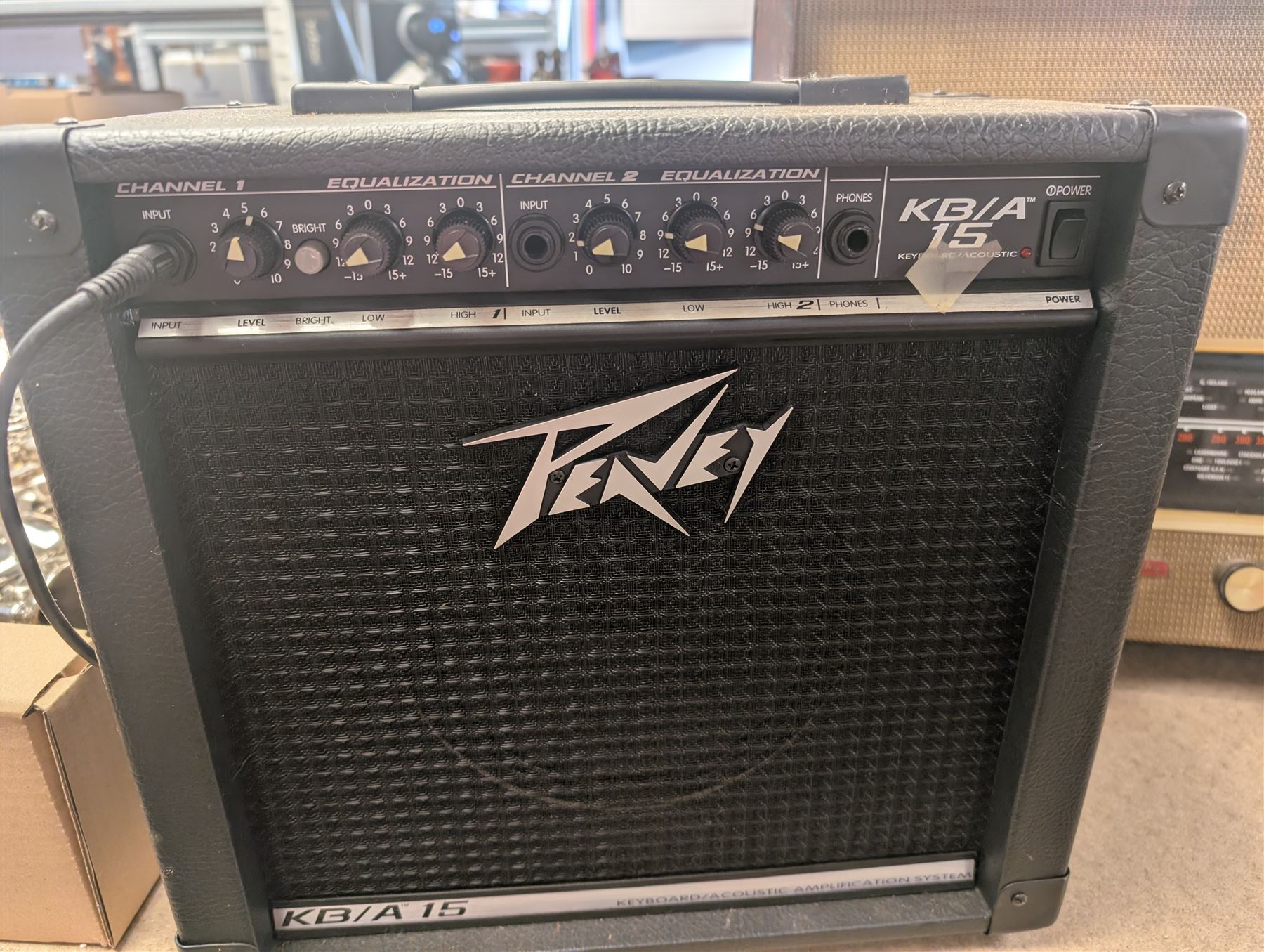 Mid 20th century Murphy radio, together with a Peavey KB/A 15 keyboard amp and pedal