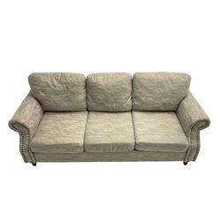 Three seat sofa, upholstered in grey fabric, scrolled arms with stud detail , raised on turned feet