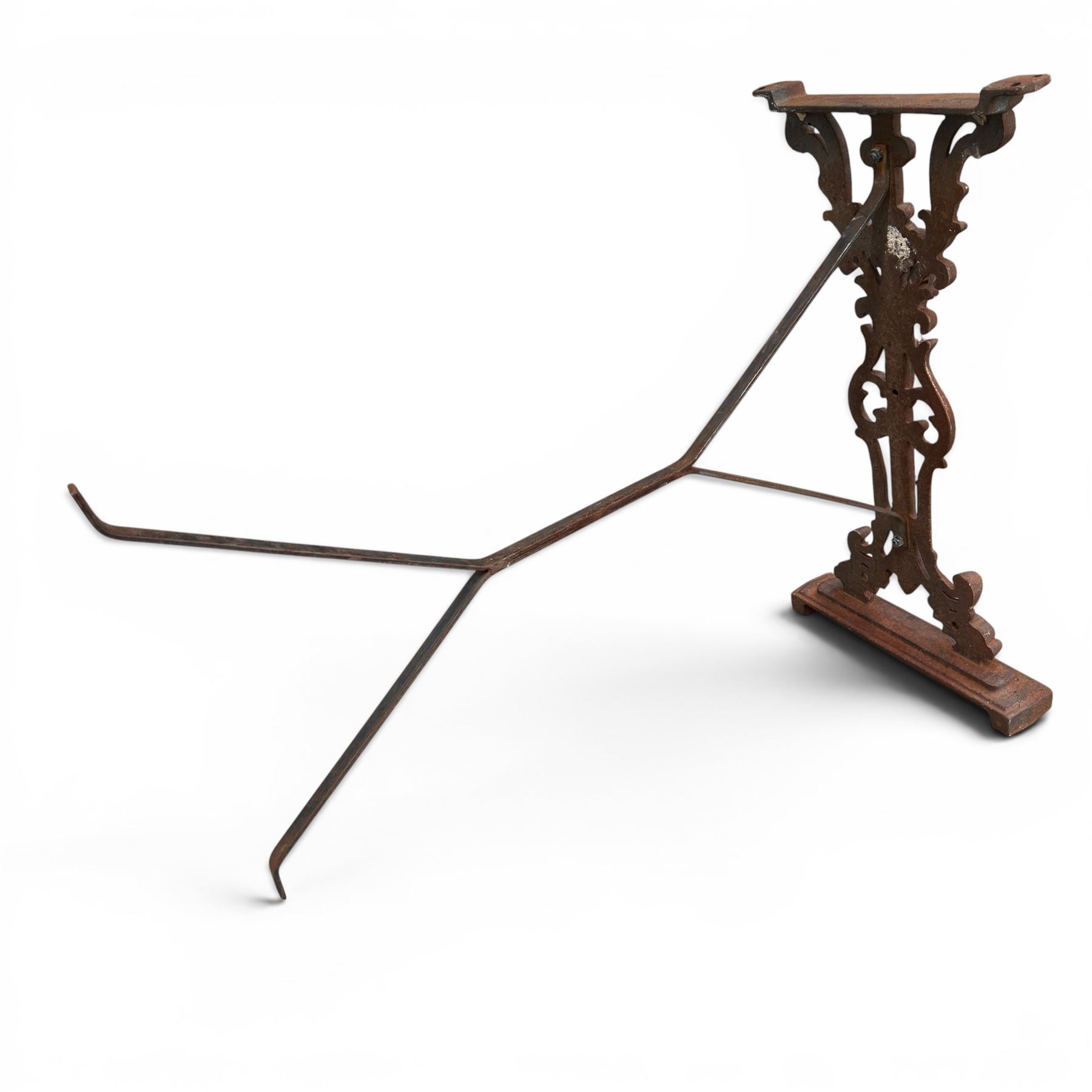 Pair of Victorian cast iron table end supports, of pierced and scrolling foliate design with central masks, united by X-form stretcher, with later top