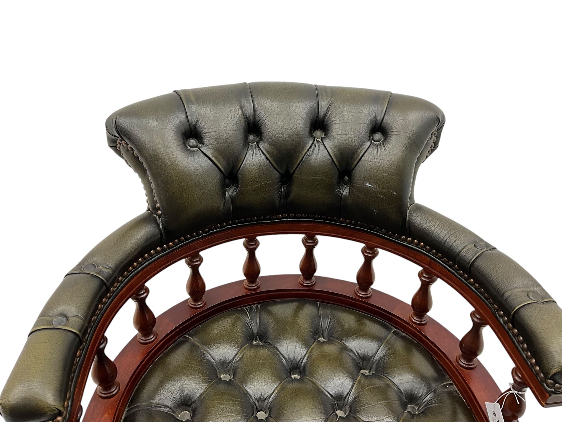 Captain's swivel desk chair, upholstered in studded green leather