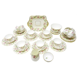  Mid 19th century Stevenson and Hancock Derby tea set hand painted with roses and thistles with gilt foliage, compromising twelve tea cups, twelve side plates and three smaller side plate, twelve saucers, milk jug, sandwich plate, sugar bowl and slop bowl (41)  