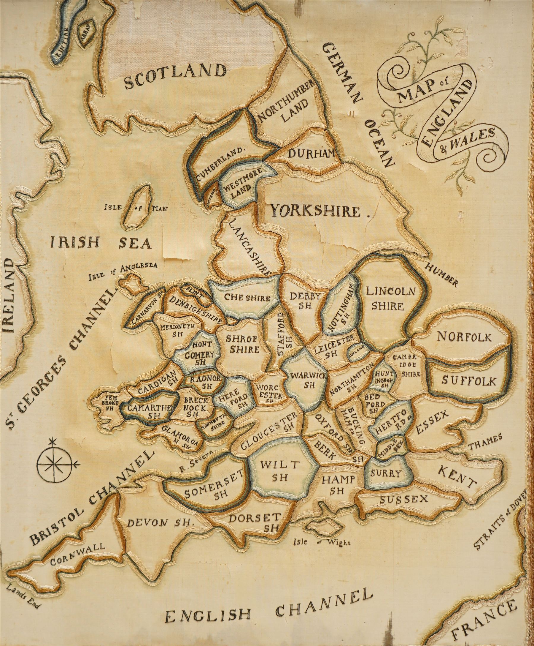 Late 18th to early 19th century framed embroidered needlework map of England and Wales on silk, divided into counties 39cm x 32cm, overall 52cm x 45cm