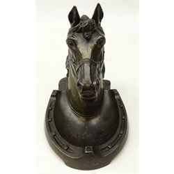  Early 20th century patinated spelter equestrian Inkstand, Horsehead cover hinged to reveal inkwell, on horseshoe base, H19cm, L19cm  