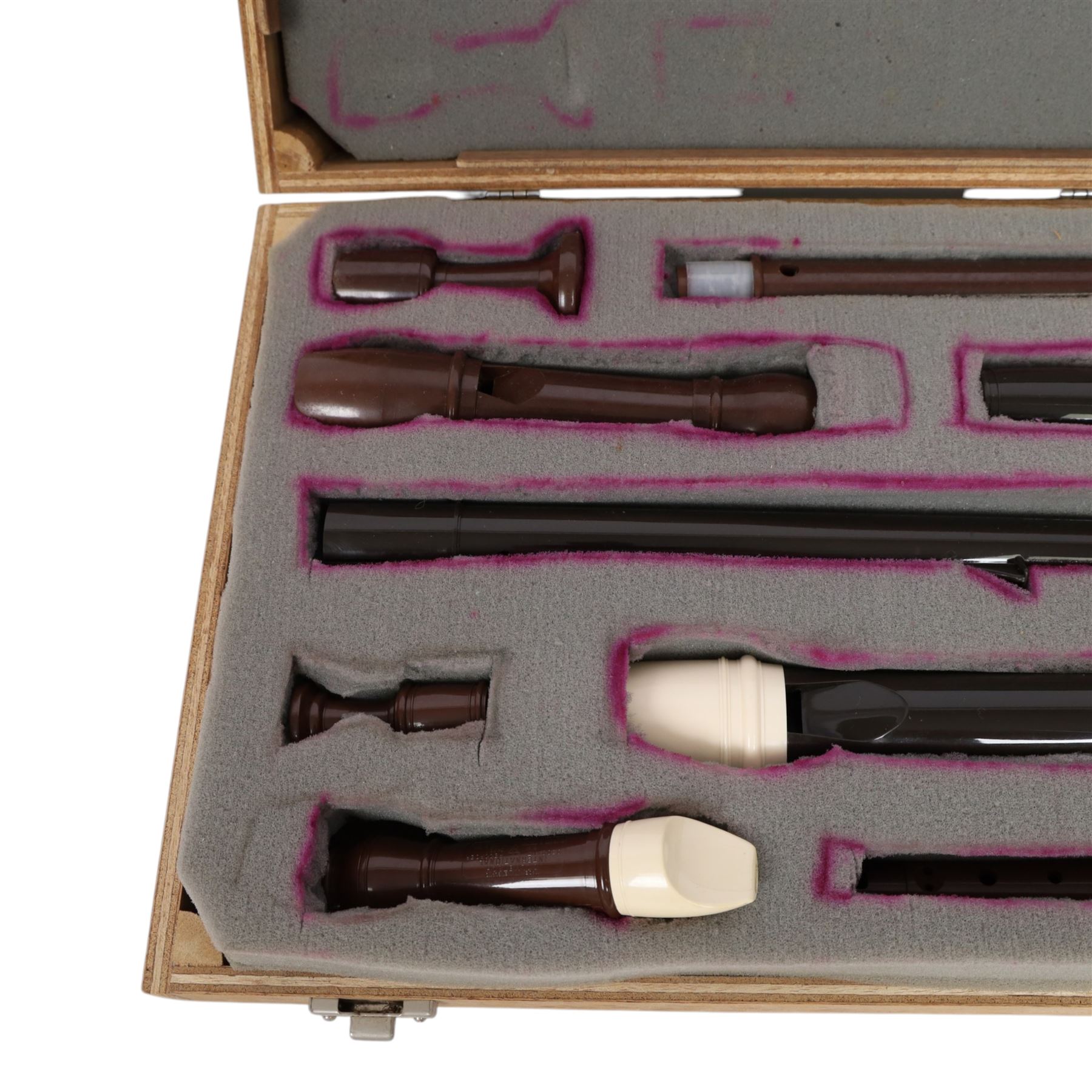 Three Dolmetsch recorders, comprising Dolmetsch International Tenor recorder, Dolmetsch Dolonite Treble recorder and a Dolmetsch International Descant recorder, all contained in a matched wooden case
