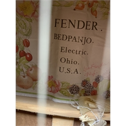 Four-string banjo guitar with mahogany circular back and sides and spruce top, mother-of-pearl inlaid fingerboard and headstock, bears humorous label 'Fender Bedpanjo', L95cm