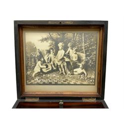 Late 19th century Symphonion disc musical box in inlaid walnut case with front lever action playing 25.5cm discs on a 10.5cm steel comb with forty-nine teeth, musical scene of cherubs under the lid, L33cm; together with five 25.5cm discs, fifteen 20.5cm discs and eleven 19cm discs