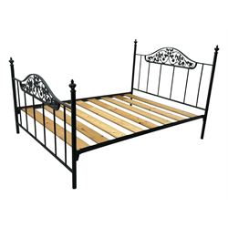Contemporary metal double bed frame, shaped head and footboards with foliate cast panels and vertical rod supports, the corner posts with urn-shaped finials, finished in a mottled verdigris-style green, with pine slatted base