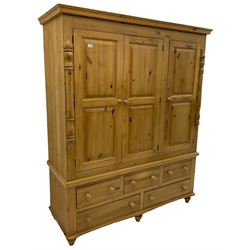Solid pine large triple wardrobe, with five base drawers