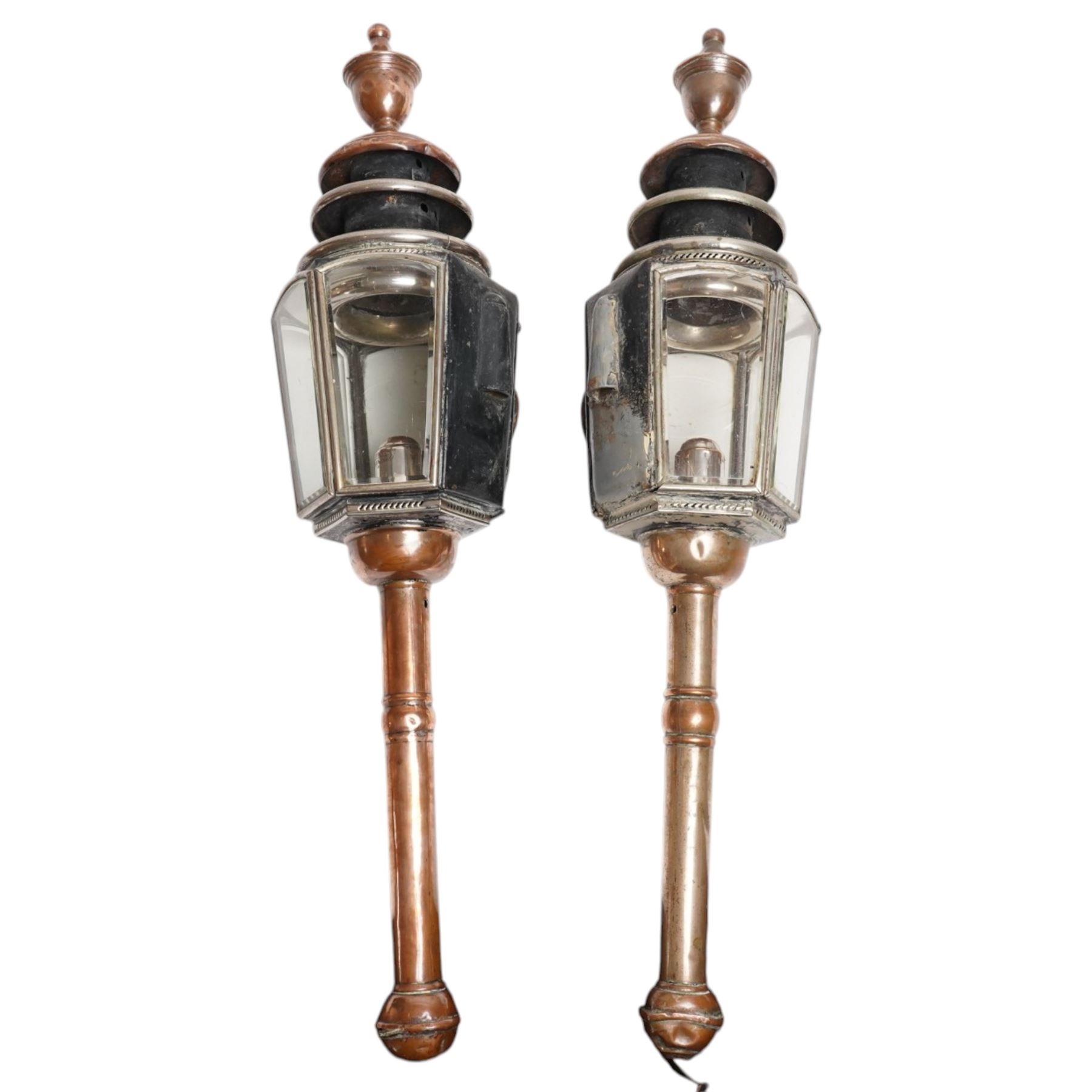 J Marston & Co. Ltd. (Birmingham) - pair of Victorian copper glazed and white metal carriage lamps with toleware outer-body, hexagonal body with faceted bevelled glass and reflective panels one inset with circular red reverse light, surmounted by a turned copper finial over a pagoda form chimney, raised on turned copper spoke, maker engraved to candle mount