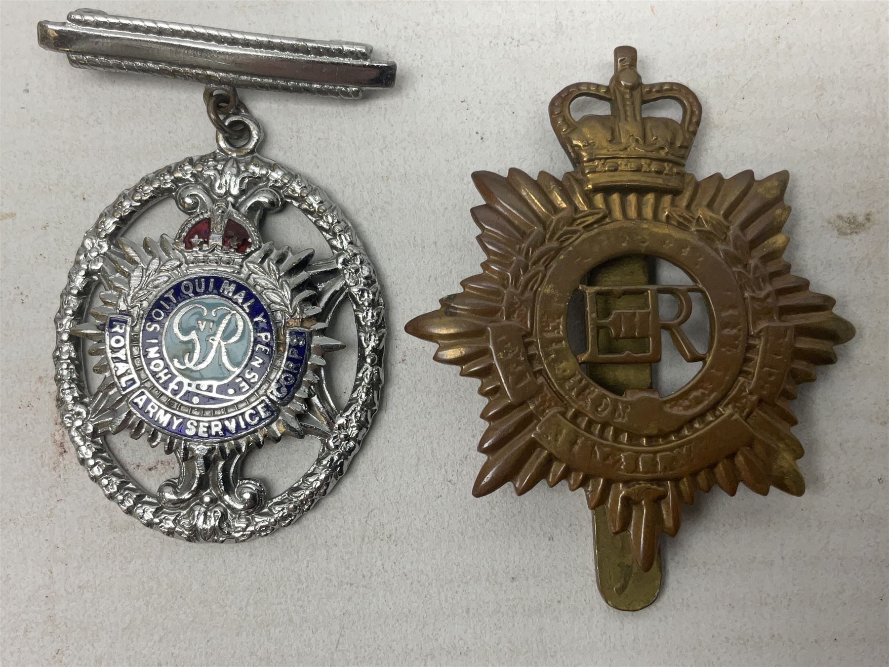 WW2 group of four medals comprising 1939-1945 War Medal, Defence Medal, Italy Star and 1939-1945 Star; with Royal Army Service Corps cap badge and RASC chrome and enamel sweetheart brooch