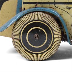 Wells tinplate clockwork limousine, the cream body, with blue roof and lithographed details, with driver and key, H8cm, L23cm
