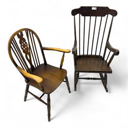 Early 20th century Windsor design rocking chair, shaped cresting rail over a spindle back, curved arms and plain seat, raised on turned supports with curved rockers; mahogany wheelback armchair raised on turned supports with H-stretcher 