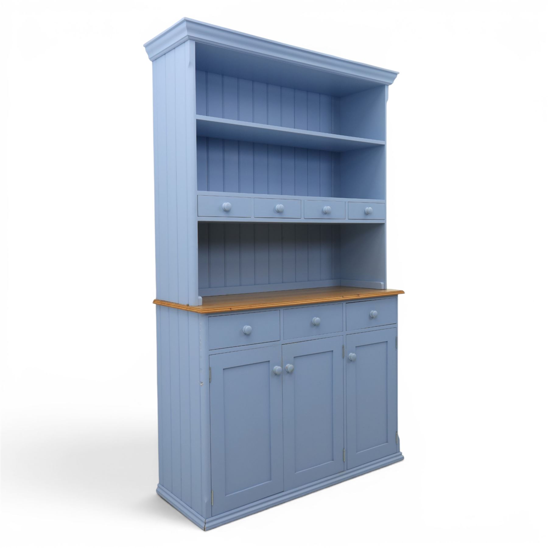 Pine blue painted dresser, upper section with tongue and grove back, two shelves with three short drawers, above a base with soft close short drawers, and three cupboard doors, raised on a moulded plinth base