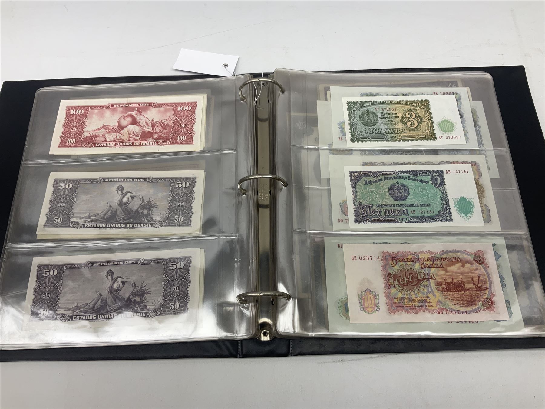 World banknotes, including Queen Elizabeth II The States of Jersey one pound 'DB202703', five pounds 'BB527762' and ten pounds 'AB651481', reserve bank of New Zealand two dollars '1L3 741894', King George V Straits Settlements one dollar 1st January 1935 'F/83 28924', various Bank of England notes etc, housed in two ring binder albums