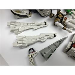 Collection of early 90s Mighty Morphin’ Power Rangers Zords, figures and accessories. Titanus the Carrier Zord, marked Bandai 1991; Green Dragonzord, incomplete; 1994 White Tigerzord with original instruction manual; 1993 Triceratops Dinozord, Mastodon Dinozord and Sabertooth Tiger Dinozord, Pterodactyl Dinozord, missing guns; with 1993 Power Morpher and original Power Coins, with further related figures, accessories and weapons