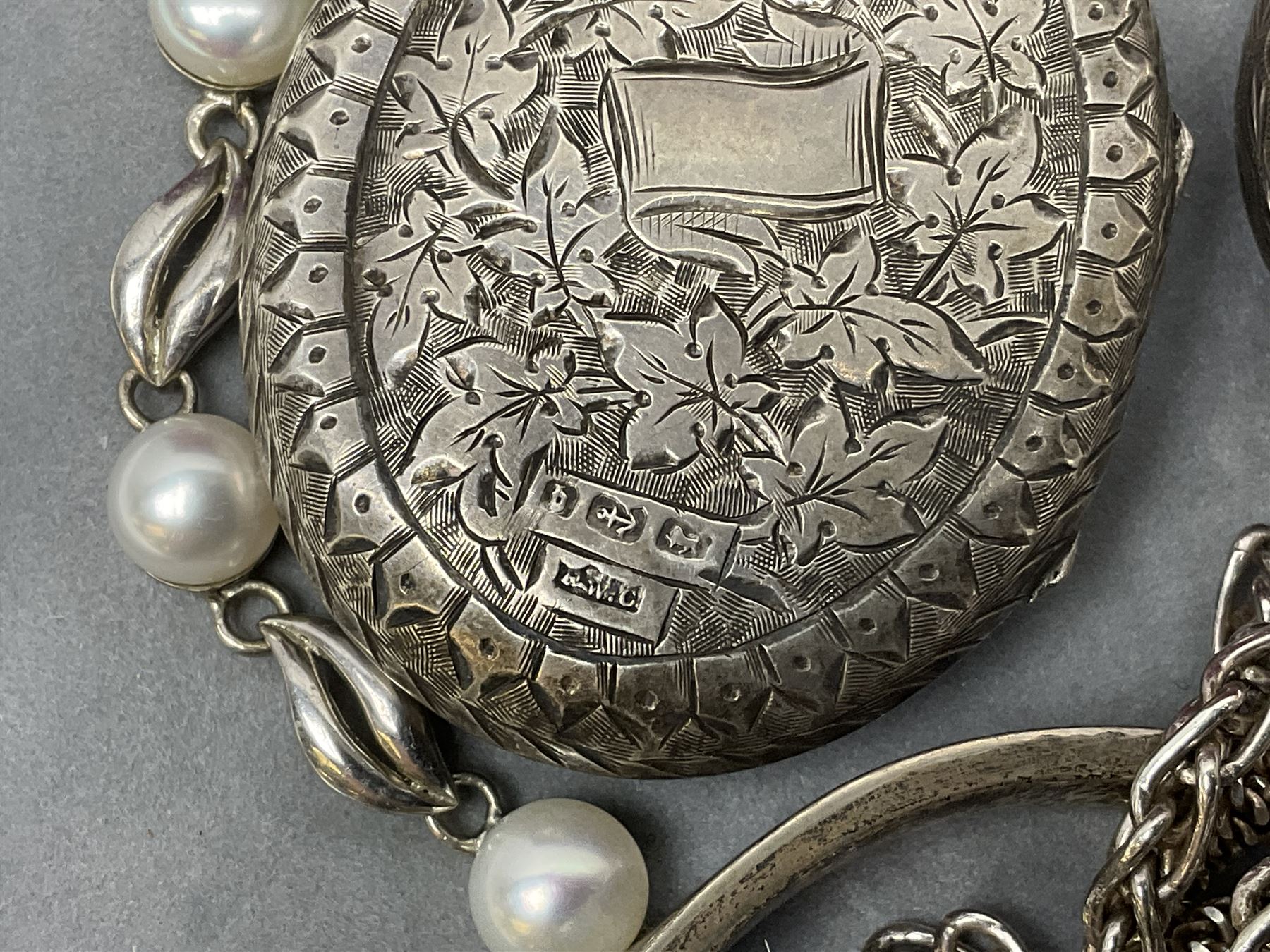 Victorian and later silver jewellery including engraved oval locket pendant, bangle, fob watch, vesta case, faux pearl necklace, butterfly wing pendant etc, a collection of costume jewellery including beaded necklaces, brooches, earrings, ladies wristwatches and a small collection of coins including two pre 1947 half crowns 