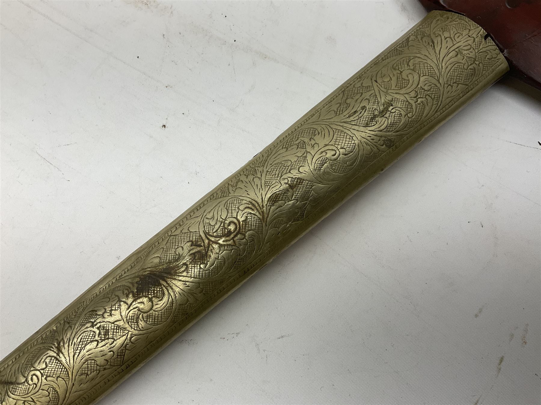 Malayan Kris dagger, the 31.5cm double edged straight heavy damascus blade with copper ferrule; carved hardwood grip; in large wooden throated scabbard with floral decorated white metal covering L47.5cm overall; a kris blade with adapted antler grip; and five various small daggers/letter openers (7)