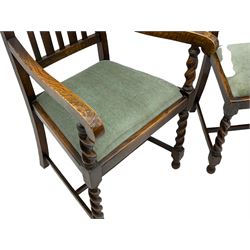 Set of four early to mid-20th century oak barely twist dining chairs, spiral turned supports joined by plain stretchers, three side chairs and one carver 