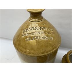 Stoneware flagon stamped H.P Woodford Wine and Spirit Merchant Gravesend, together with stoneware bottle stamped Least Louth and three stoneware jars, flaggon H42cm