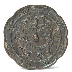 19th century Oriental bronze mirror with a raised pattern of dragons D12cm