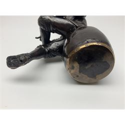 Oriental bronze figure of a gentleman, modelled seated upon barrel with a pipe in one hand and a flask in the other, H21cm