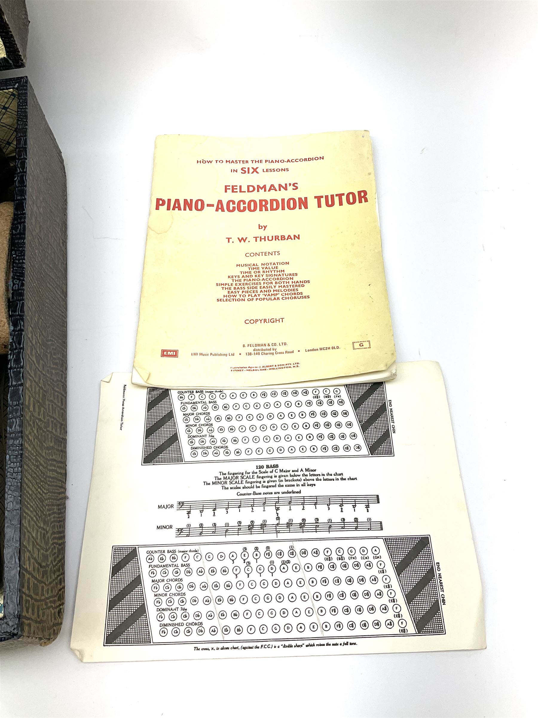 GDR Firotti piano accordion with black and silver case, sixteen keys and forty-eight buttons L38cm; in simulated reptile skin case with sheet music